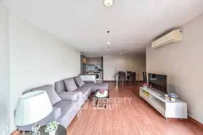 Spacious modern living room with open kitchen and stylish decor