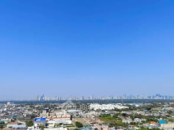 Stunning panoramic cityscape view with clear blue sky, perfect for urban living enthusiasts.
