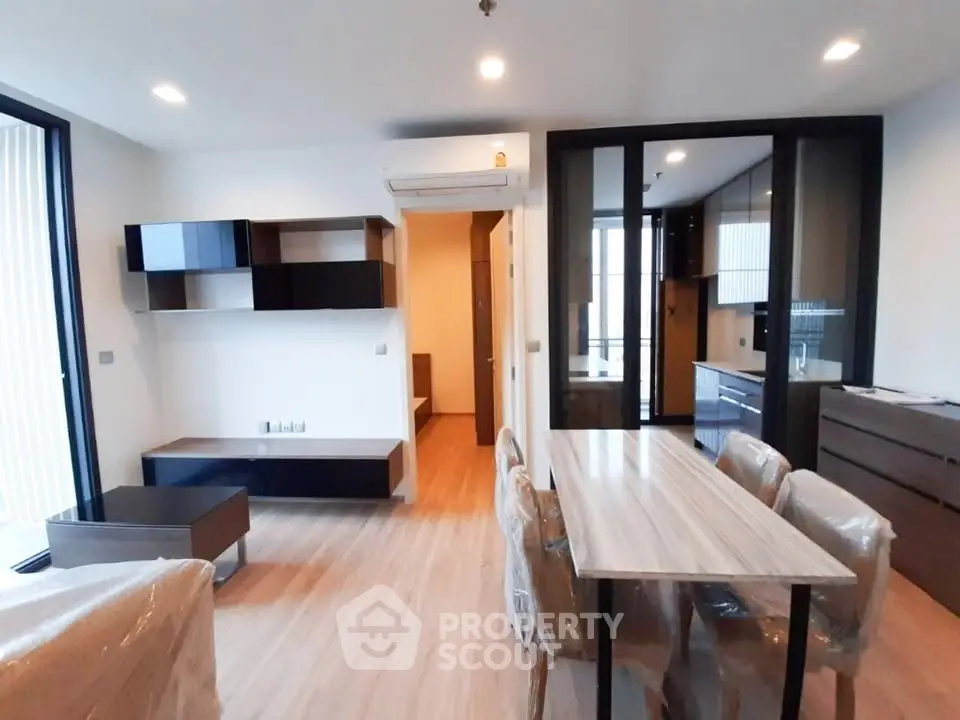 Modern living room with open layout and stylish furniture in a contemporary apartment.