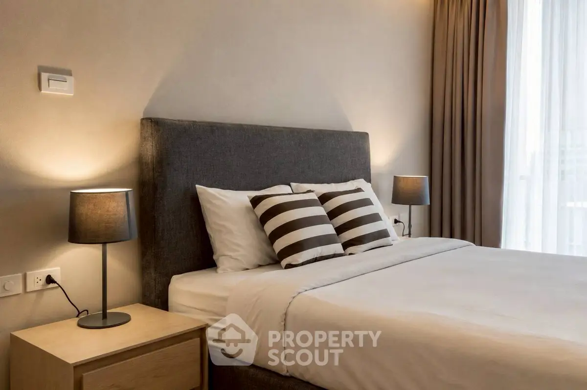 Elegant bedroom with modern decor and cozy lighting, perfect for relaxation and comfort.