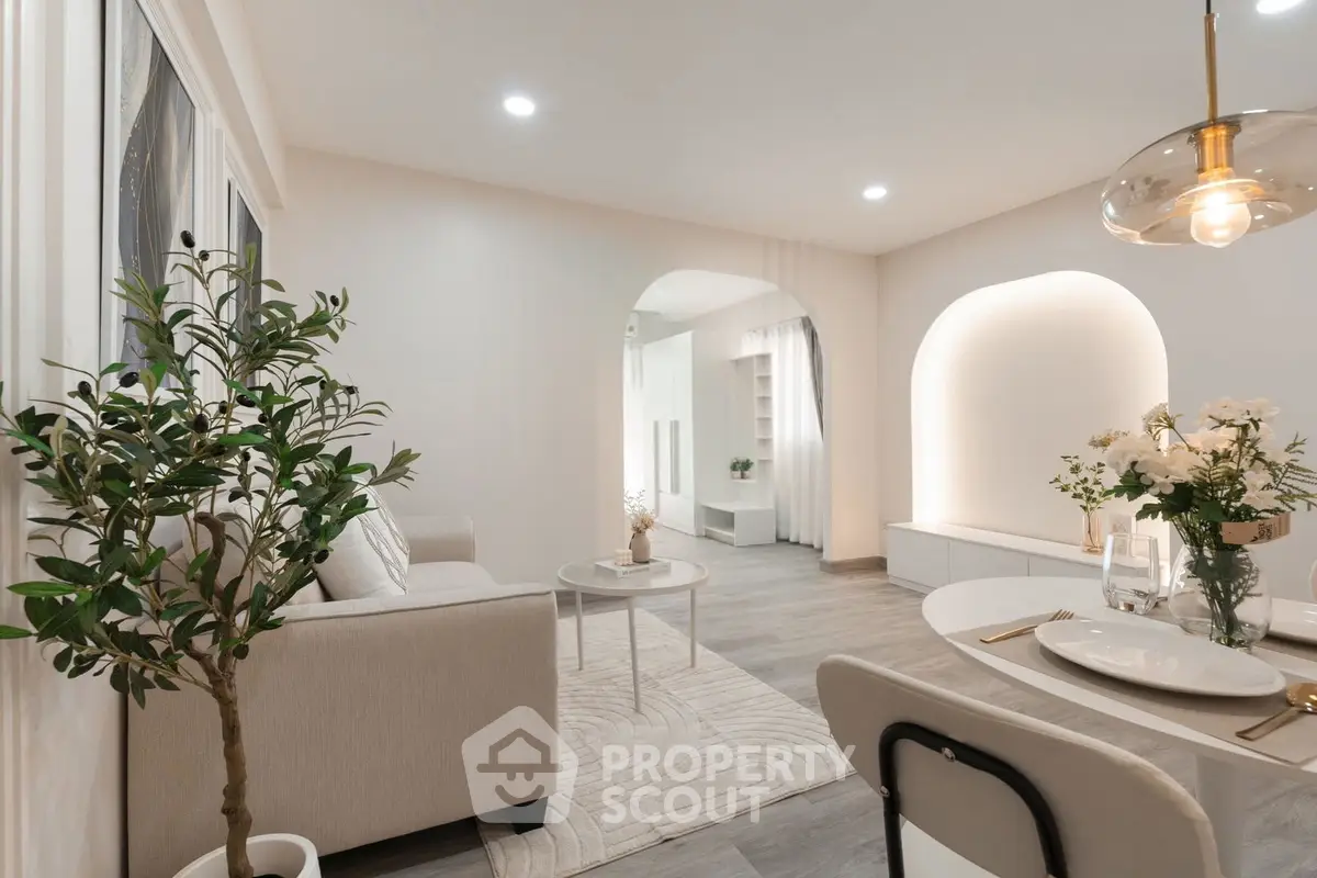 Elegant living room with modern decor, cozy seating, and stylish lighting, perfect for relaxation and entertaining.