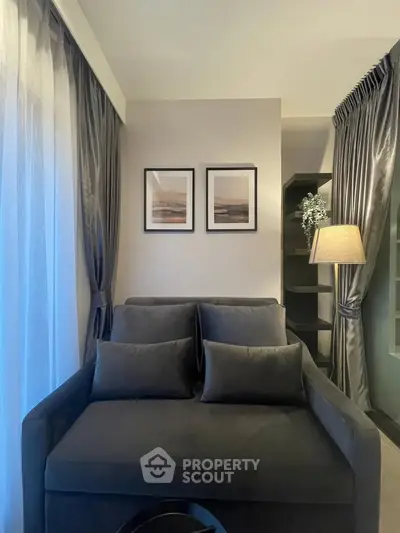 Cozy living room with elegant gray sofa and stylish decor