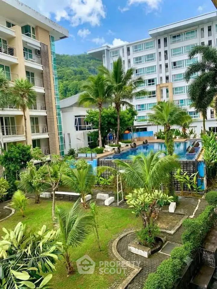 Luxurious condominium with pool and lush garden view, perfect for resort-style living.