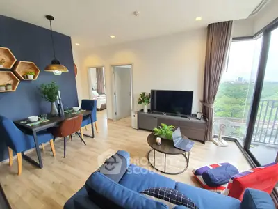 Modern living room with blue accents, large windows, and a scenic view, perfect for urban living.