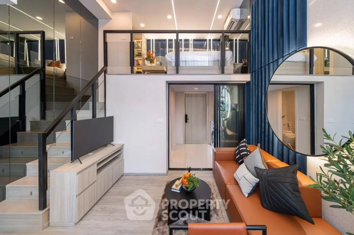 Modern duplex living room with stylish decor and mezzanine level