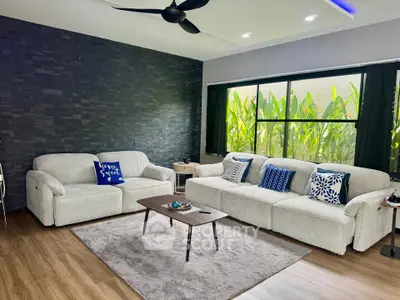 Stylish living room with modern decor, large windows, and cozy seating area.