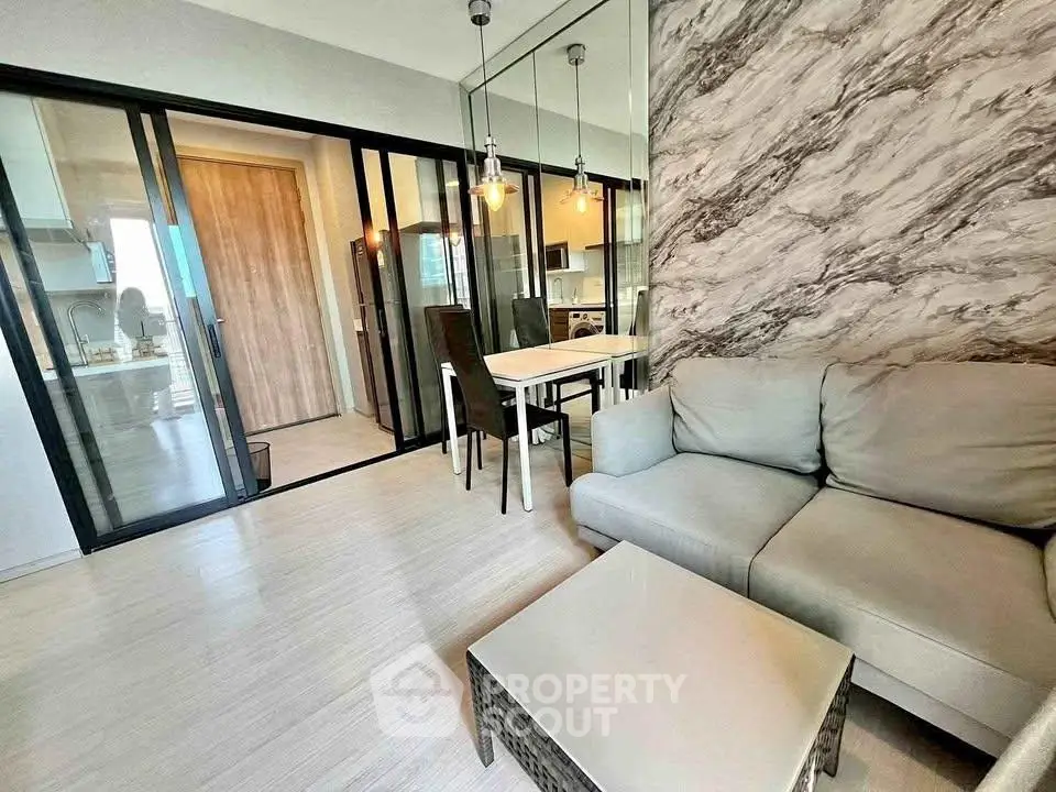 Modern living room with stylish decor and open kitchen layout