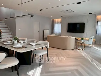 Luxurious open-plan living room with modern dining area and elegant decor