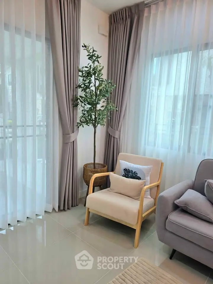 Elegant living room with modern decor and natural light