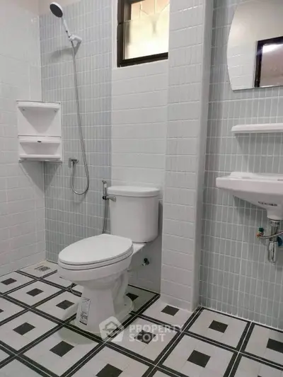 Modern bathroom with sleek tiles and contemporary fixtures, perfect for a stylish home upgrade.