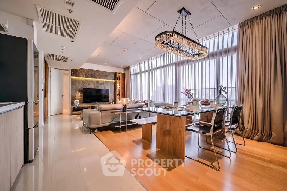 Luxurious modern living room with elegant dining area and stunning chandelier