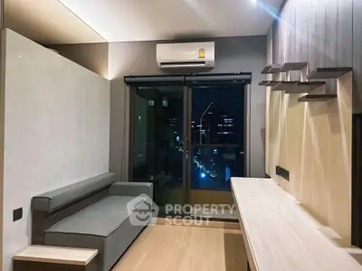 Modern living room with city view, sleek furniture, and ambient lighting.