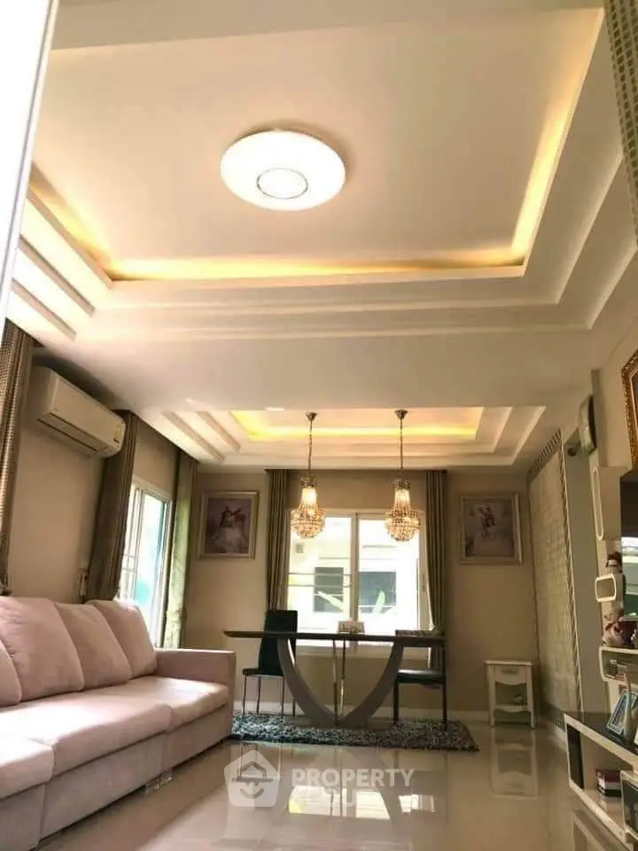 Elegant living room with modern ceiling design and cozy seating area