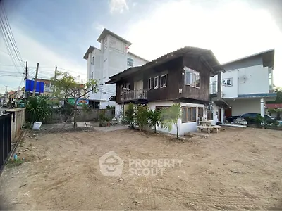 Charming rustic wooden house with spacious yard in urban setting