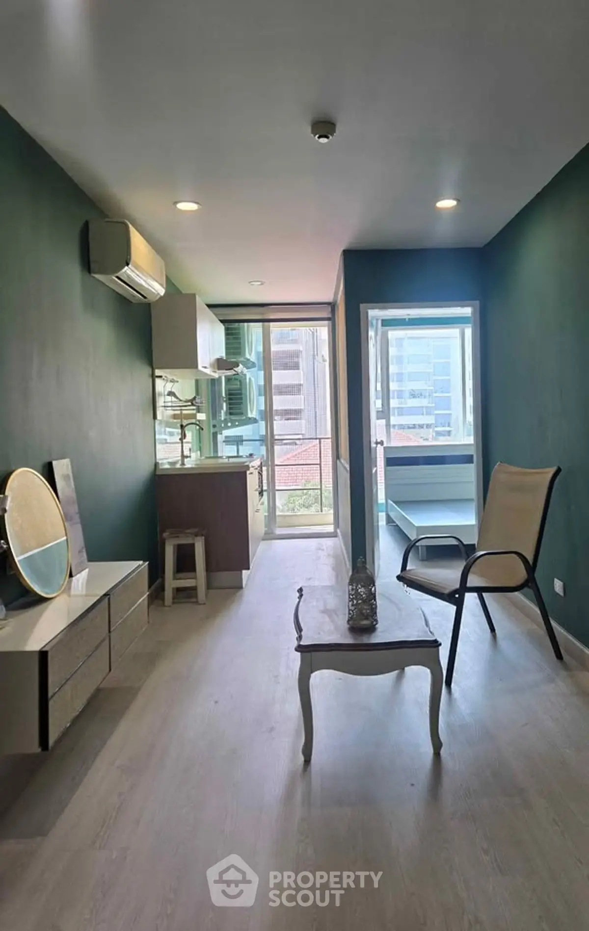 Modern living room with stylish furniture and city view balcony in urban apartment