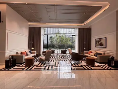 Luxurious modern living room with elegant furniture and large windows offering garden view
