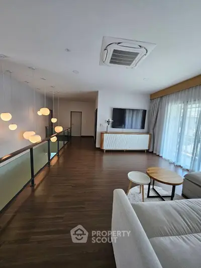 Modern living room with stylish lighting and large windows