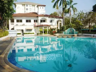 Luxurious villa with stunning pool and lush greenery, perfect for relaxation and entertainment.