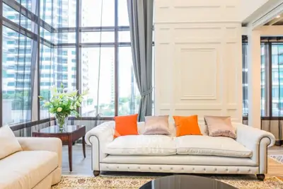 Luxurious living room with elegant sofa and panoramic city view