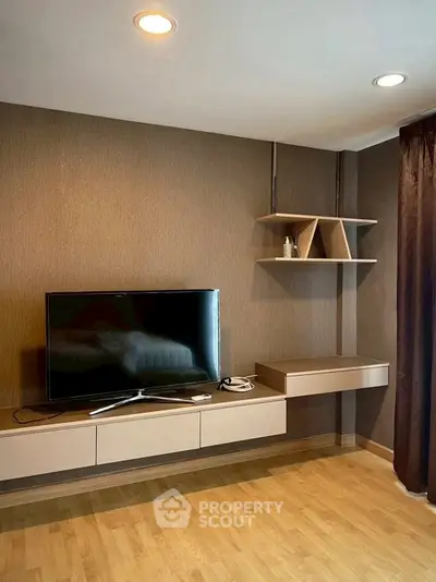 Modern living room with sleek TV unit and stylish shelving, perfect for contemporary living.