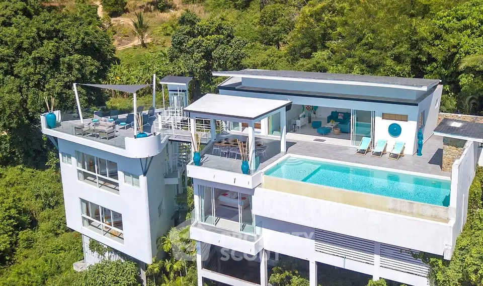 Luxurious modern villa with infinity pool and stunning forest views.