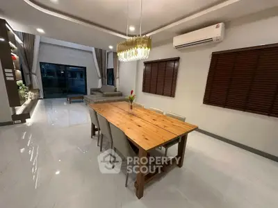 Spacious modern living room with elegant dining area and stylish lighting