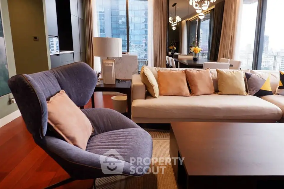 Luxurious modern living room with city view, elegant furniture, and stylish decor.