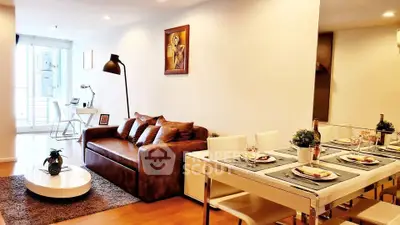 Stylish open-plan living and dining area with modern decor and natural light.