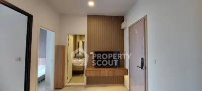 Modern apartment interior with TV and bathroom view