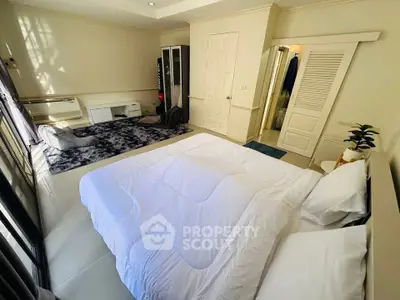 Spacious bedroom with modern decor and natural light