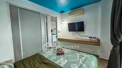 Modern bedroom with TV, air conditioning, and stylish decor
