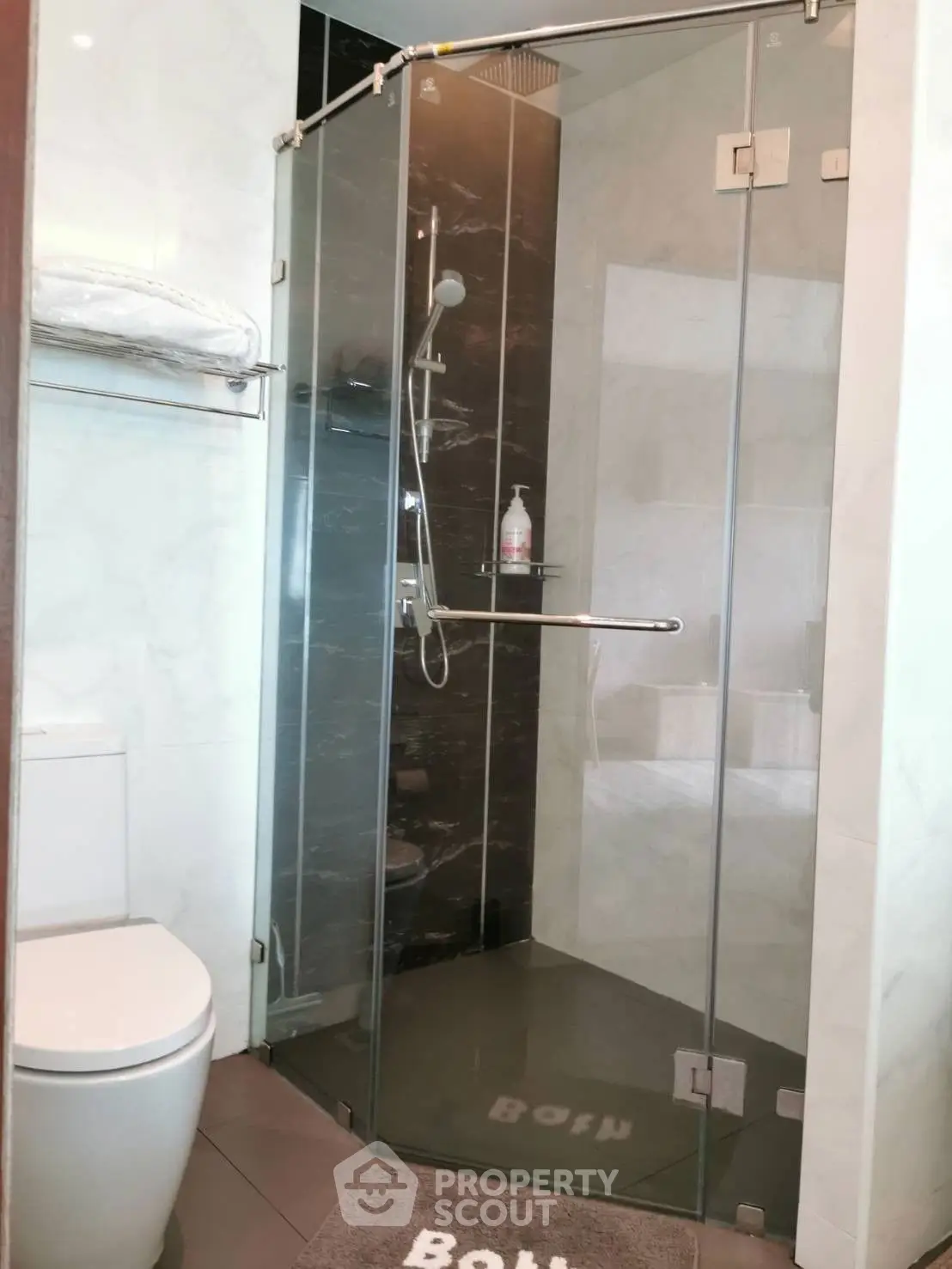Modern bathroom with glass shower and sleek fixtures
