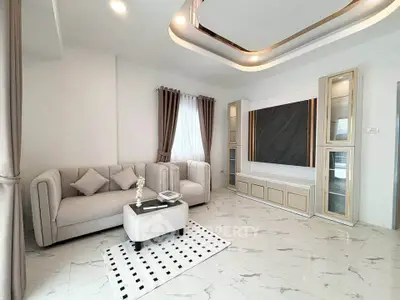 Elegant modern living room with plush sofas and stylish decor