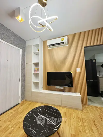 Modern living room with stylish lighting and wooden accents