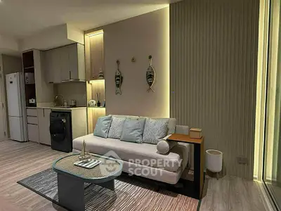 Modern living room with stylish decor and open kitchen layout
