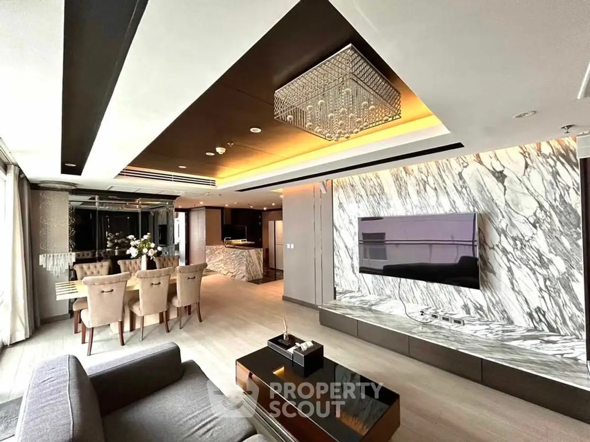 Luxurious modern living room with marble accents and elegant dining area
