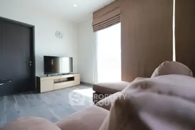 Modern living room with sleek furniture and natural light