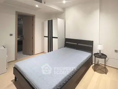 Modern minimalist bedroom with sleek furniture and neutral tones