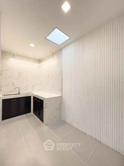 Modern bathroom with marble accents and sleek cabinetry