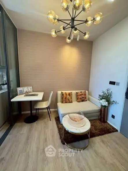 Modern living room with stylish lighting and cozy seating area in a contemporary apartment.