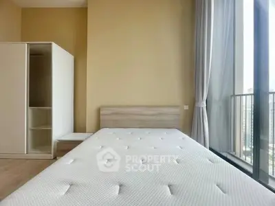 Modern bedroom with large window and minimalist furniture