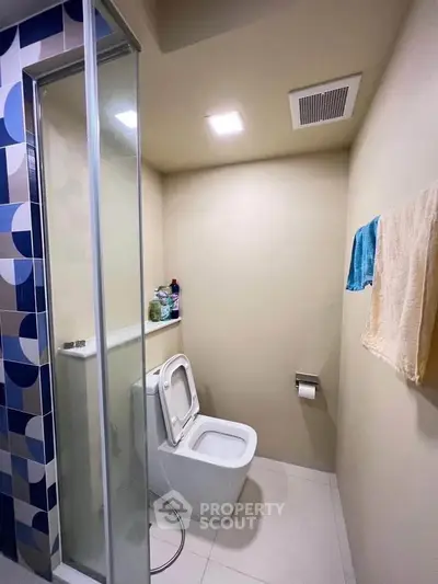 Modern bathroom with sleek design and glass shower enclosure