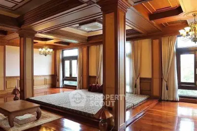 Luxurious wooden interior bedroom with large windows and elegant decor.