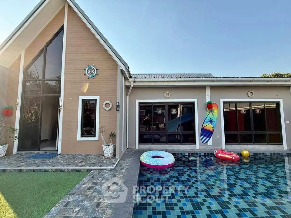 Charming modern home with inviting pool and stylish exterior design.