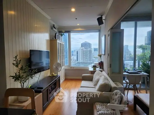 Modern living room with city view, cozy seating, and natural light.