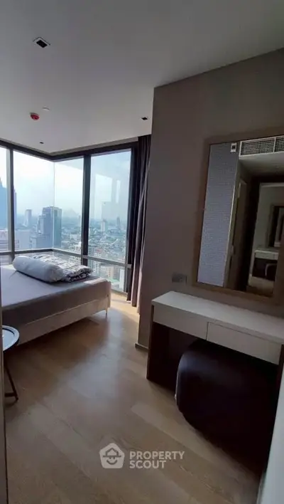 Modern bedroom with panoramic city view and stylish decor