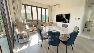 Spacious modern living room with elegant dining area and massage chair