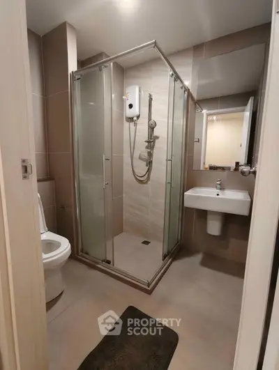 Modern bathroom with glass shower and sleek fixtures