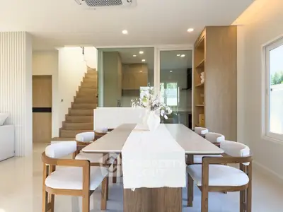 Elegant dining area with modern wooden furniture and natural light