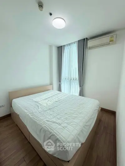 Cozy bedroom with natural light and modern air conditioning